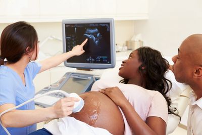Couple with Doctor looking at sonogram